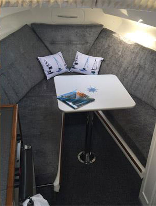 A re-upholstered yacht V berth seating and sleeping area