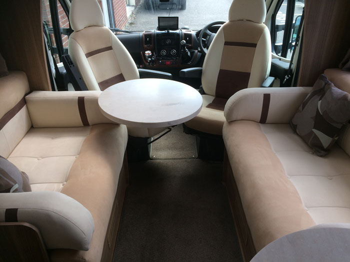 Motorhome cab seats and seating area cushions re-upholstered in a modern fabric