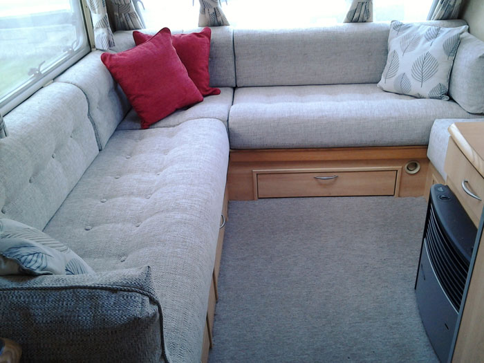 A touring caravan that has been transformed with new upholstery, furnishings and curtains