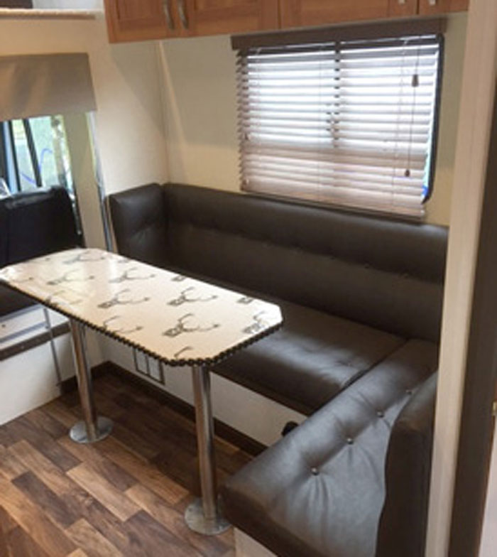 The same horsebox setaing area re-upholstered in a practical wipe-clean vinyl fabric