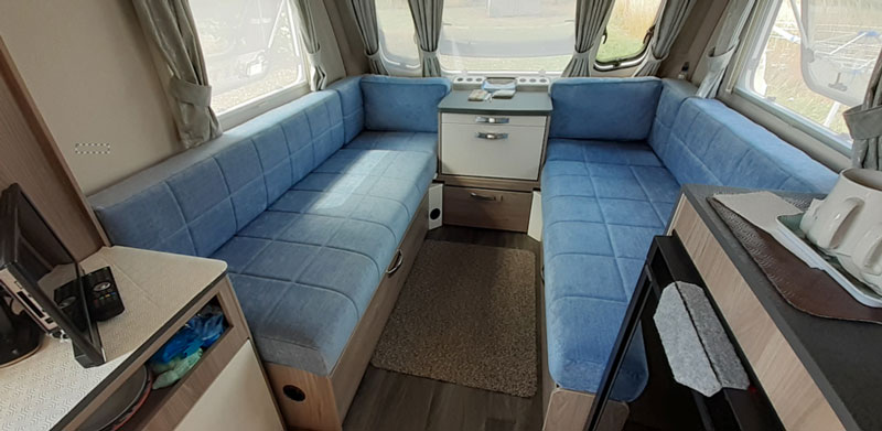 A touring caravan that has been transformed with new upholstery in Scenario Sky fabric.